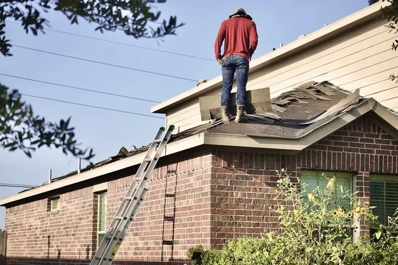 Professional roofer working on a residential roof in Lake Dallas